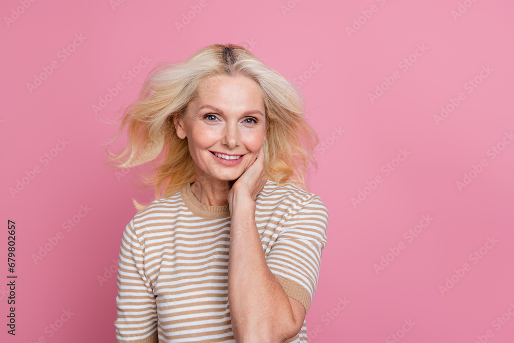 Photo of nice elderly woman touch chin beautiful perfect skin face peeling mask hydration isolated on pink color background Photo of nice elderly woman touch chin beautiful perfect skin face peeling mask hydration isolated on pink color background