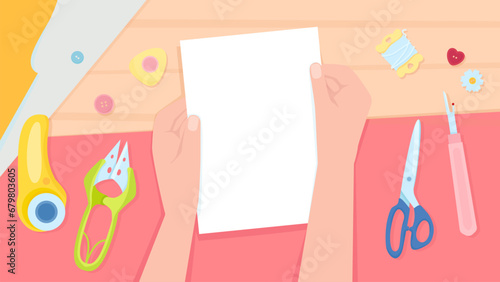Two female hands on the background of a table with sewing tools
