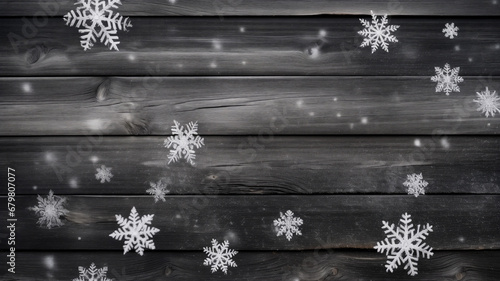 Snowflakes on black wooden background. Christmas and New Year concept.
