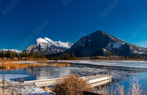 Mount Rundle and a partially frozen Vermillion Lakes. Banff National Park, Alberta, Canada photo