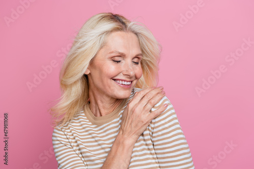 Photo of cute lovely lady closed dressed stylish clothes enjoying fresh smell comfort isolated on pink color background