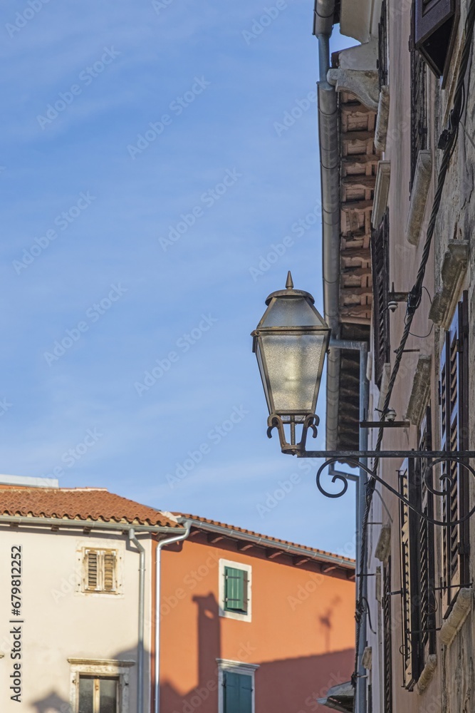 Picture of a historic street lamp on a house wall