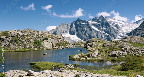 Beautiful mountain landscape with a glacial lake. Lake Mandrone, Italy. Panoramic image