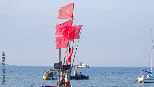 Industrial Fishing Net Marker Flags Stored at Harbor photo