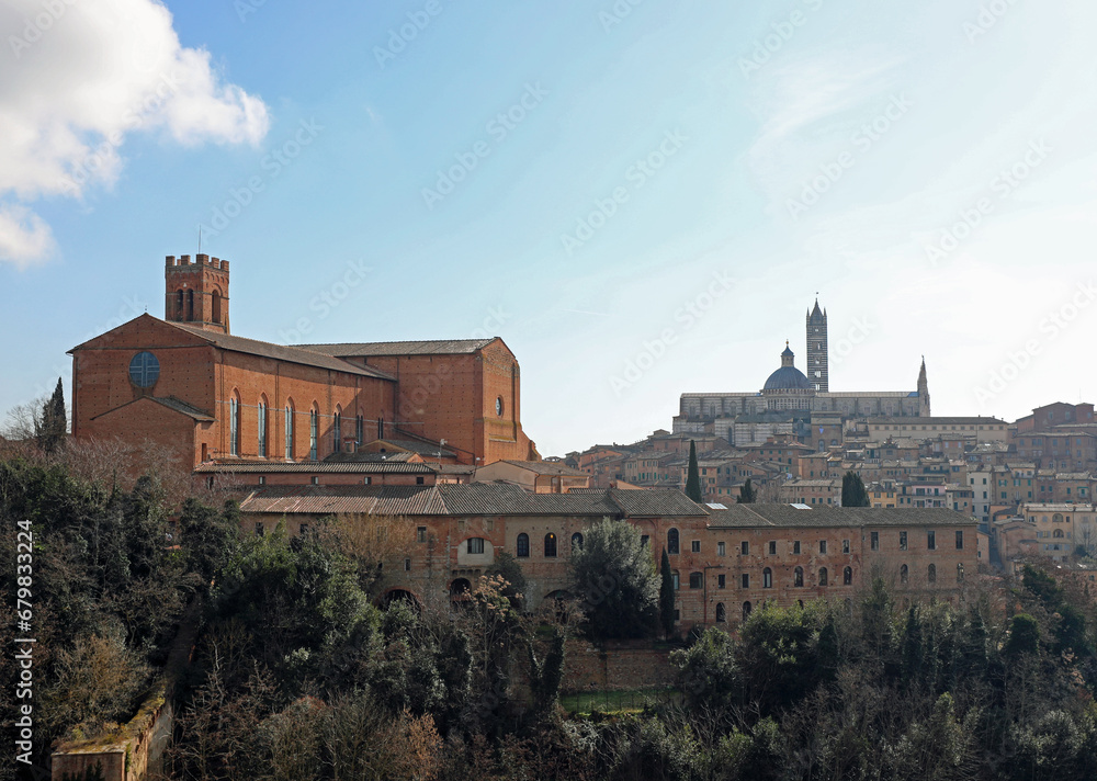 panorama of the city of Siena with the cathedral and the church of San Domenico on the hill in Italy