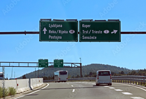 road signs on the Slovenian highway to reach Ljubljana or go towards the Italian borders and the city of Trieste