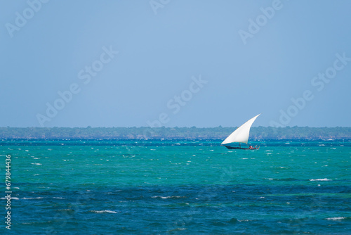 Dhow boat sails in the ocean, summer concept, copy-space, Zanzibar in Tanzania.