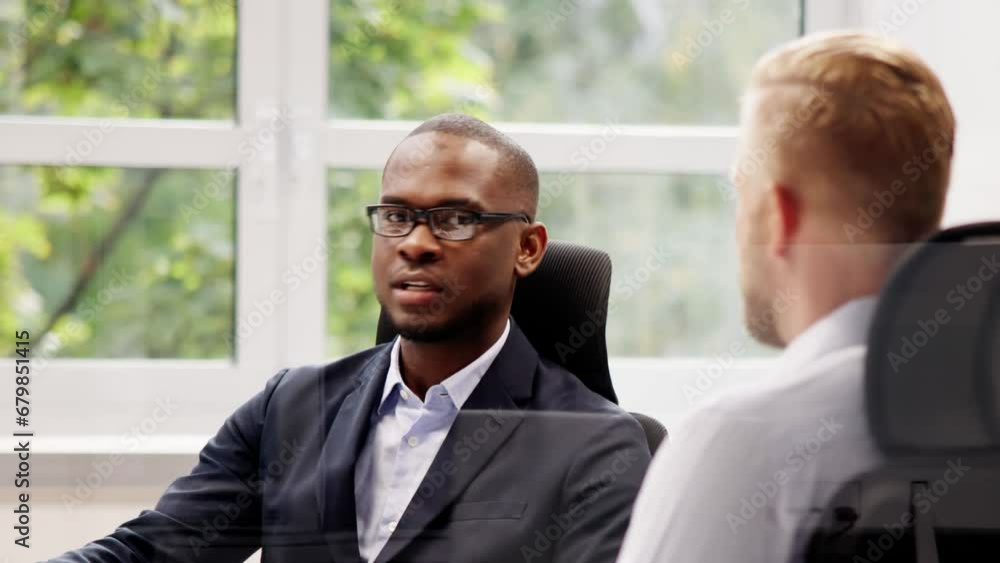 Two Businesspeople Talking With Each Other Two Businesspeople Talking With Each Other