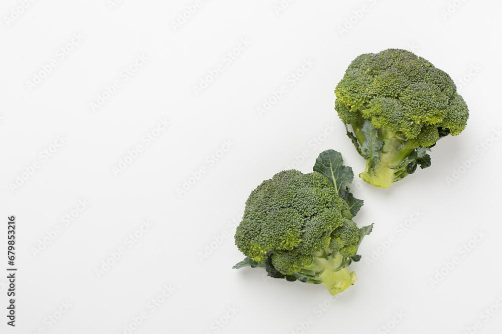 Flat lay with fresh broccoli on white background Flat lay with fresh broccoli on white background