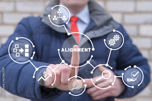Man using virtual touch screen presses word: ALIGNMENT. Business alignment strategy concept. Ideas for creativity. Ordering or alignment.