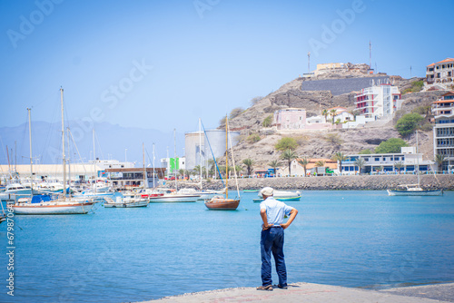 Old man looking to Laginha beach in Mindelo city in Sao Vicente Island in Cape Verde © Vanco