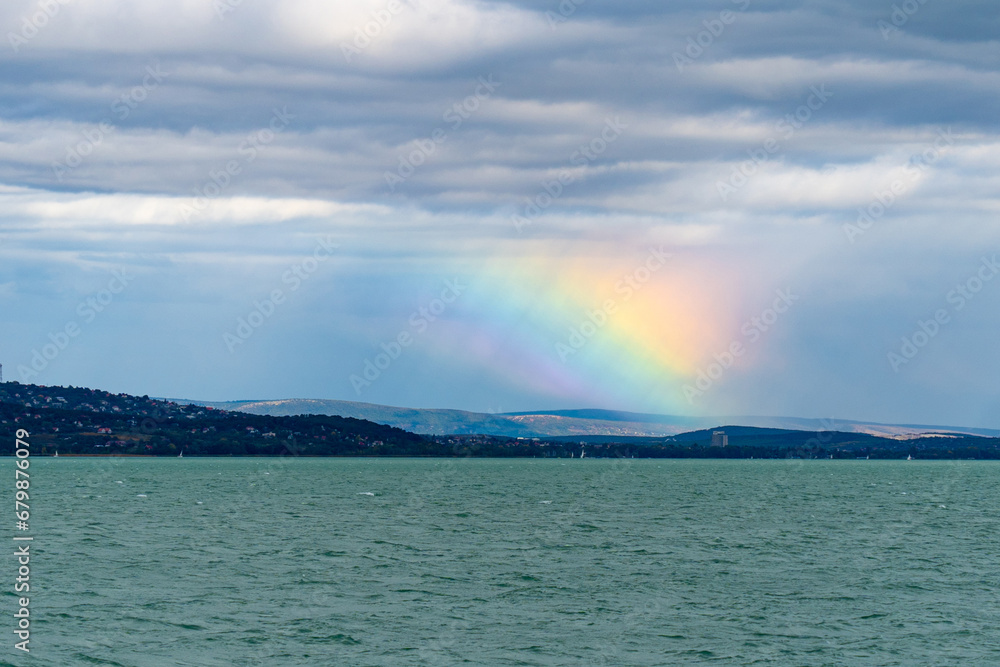 Obraz premium Rainbow refraction over Lake Balaton in autumn