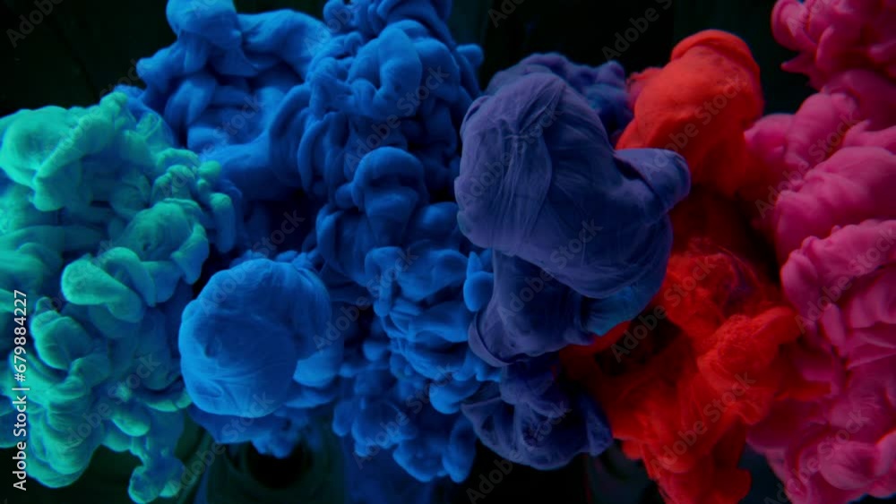 Abstract background, colorful liquid pouring isolated on black background, super slow motion filmed on high speed cinema camera at 1000 fps Abstract background, colorful liquid pouring isolated on black background, super slow motion filmed on high speed cinema camera at 1000 fps