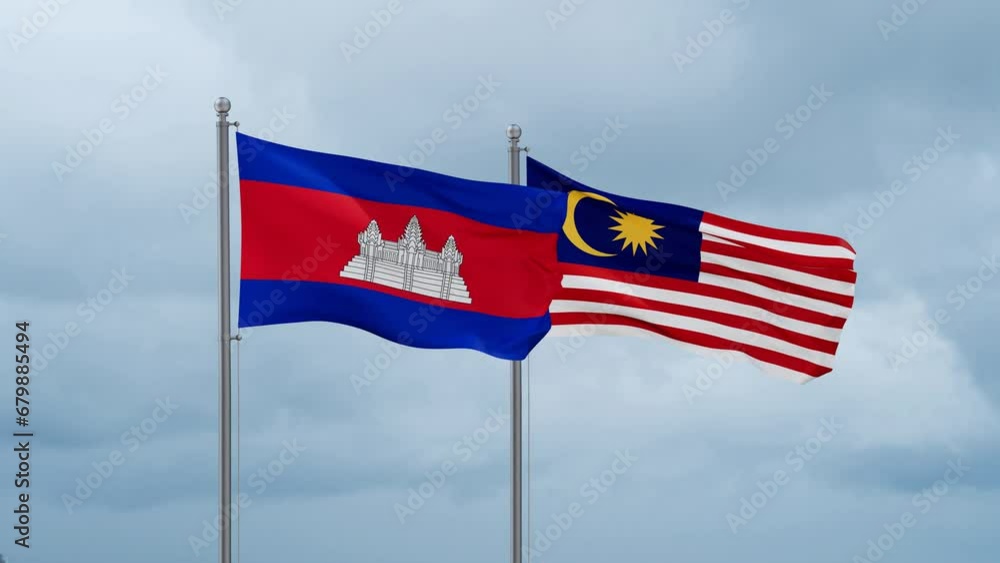 Malaysia and Cambodia flag waving together on cloudy sky, endless seamless loop, two country cooperation concept Malaysia and Cambodia flag waving together on cloudy sky, endless seamless loop, two country cooperation concept
