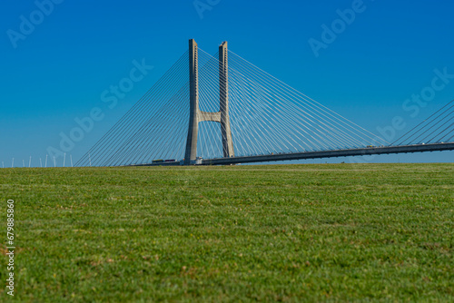 Pillars of Vasco da Gama bridge hidden by lawn. Image captured on July 14, two weeks before the start of the world youth days event photo