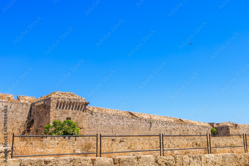 Airplane in the sky over the ancient city. Background with selective focus and copy space