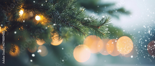 Christmas background with bokeh defocused lights and fir tree branches. photo