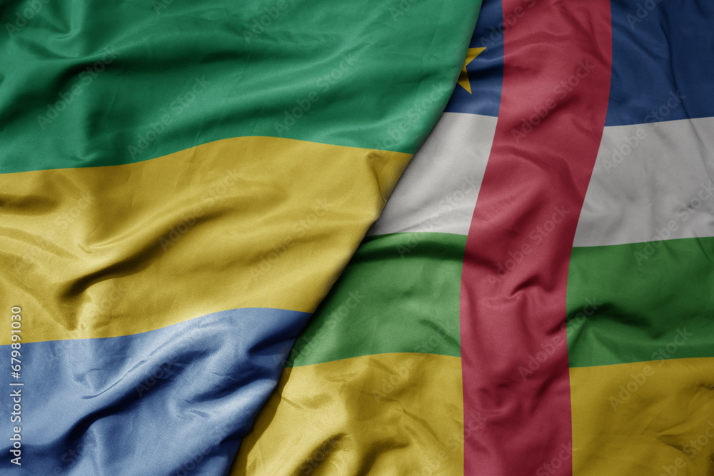 Obraz premium big waving national colorful flag of central african republic and national flag of gabon .