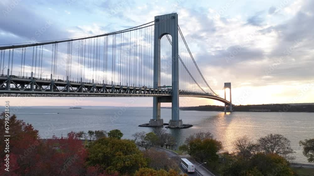 Aerial shot of traffic crossing The Verrazzano Bridge on an autumn afternoon. Aerial shot of traffic crossing The Verrazzano Bridge on an autumn afternoon.