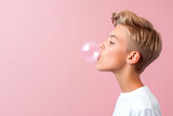 Boy with chewing gum on color background