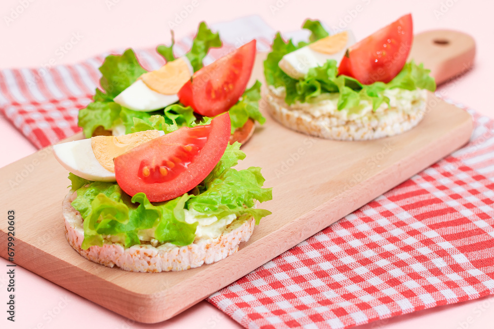 Rice Cake Sandwiches with Tomato, Lettuce and Egg on Wooden Cutting Board. Easy Breakfast. Diet Food. Quick and Healthy Sandwiches. Crispbread with Tasty Filling. Healthy Dietary Snack Rice Cake Sandwiches with Tomato, Lettuce and Egg on Wooden Cutting Board. Easy Breakfast. Diet Food. Quick and Healthy Sandwiches. Crispbread with Tasty Filling. Healthy Dietary Snack