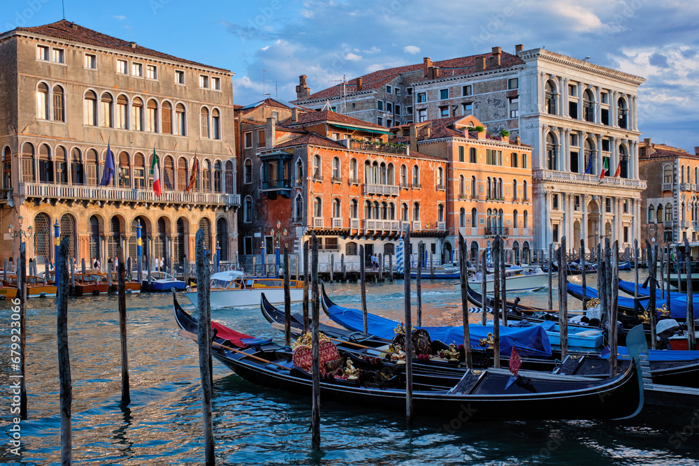 Grand Canal with boats and gondolas on sunset, Venice, Italy