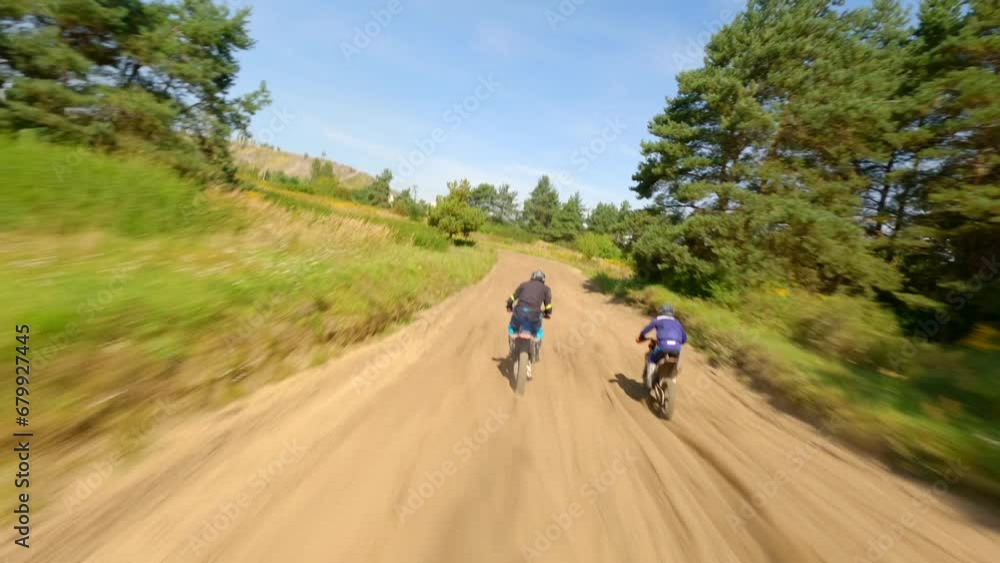 FPV of riders on a motocross track. Aerial high-speed. FPV of riders on a motocross track. Aerial high-speed.