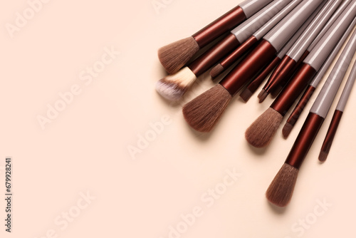 Makeup brushes on pink background