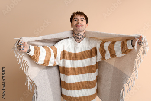 Young man with plaid openin...
