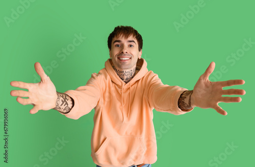 Young man opening arms for ...
