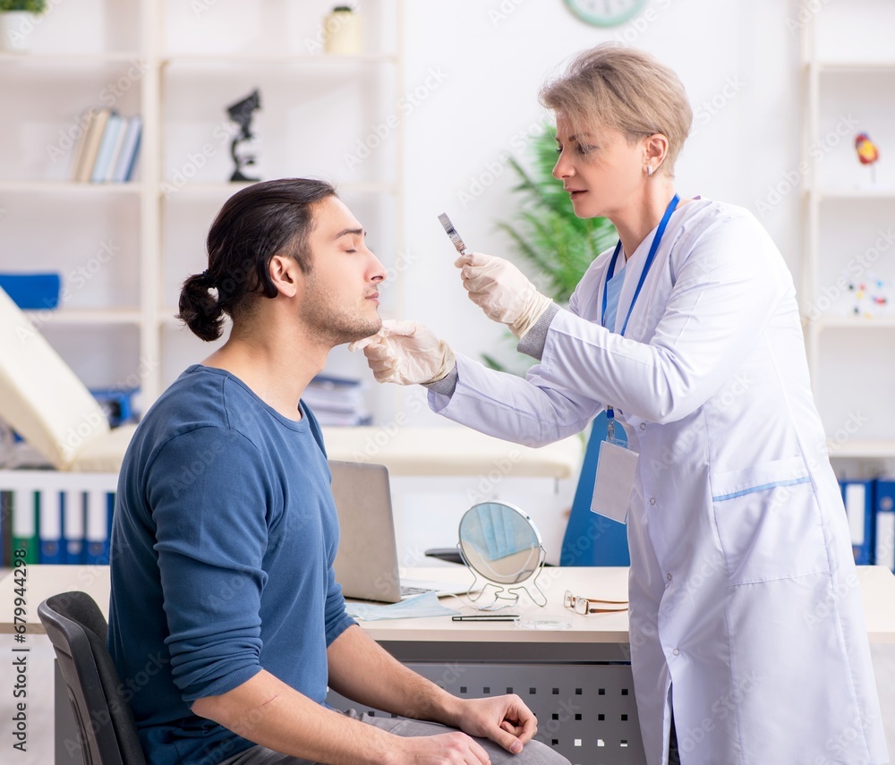 Young patient visiting doctor in hospital Young patient visiting doctor in hospital