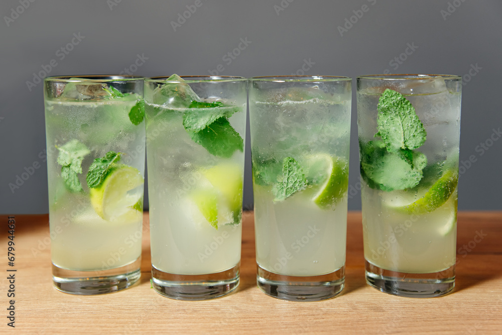 Glasses of Mojito party drinks with Lime, Mint, and Bubbly water Glasses of Mojito party drinks with Lime, Mint, and Bubbly water