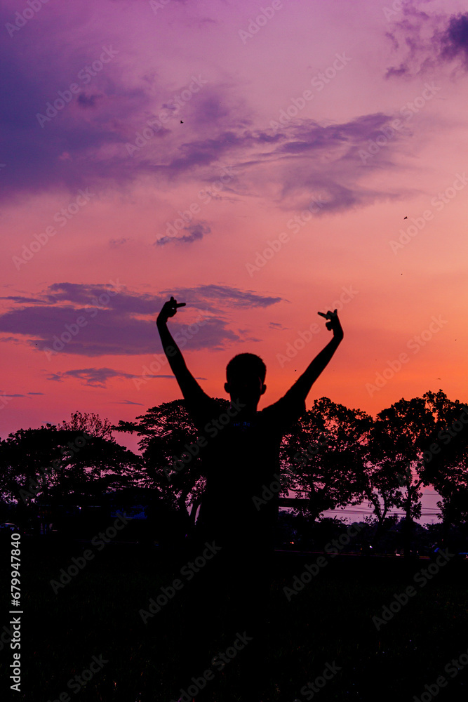 silhouette of a person in the sunset