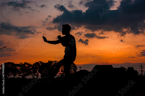 silhouette of a person on a sunset