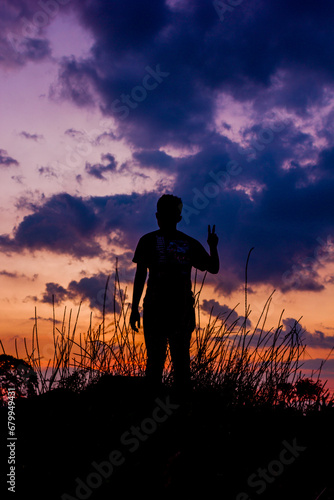 silhouette of a person with a rifle