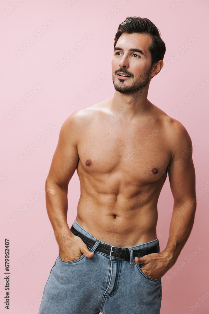 Fototapeta premium Muscle man background jeans lifestyle holiday sport pink torso belt muscular fitness body sexy naked