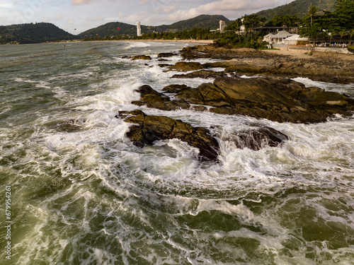 Aerial view of Waves crashing on seashore,Sea surface ocean waves background © panya99