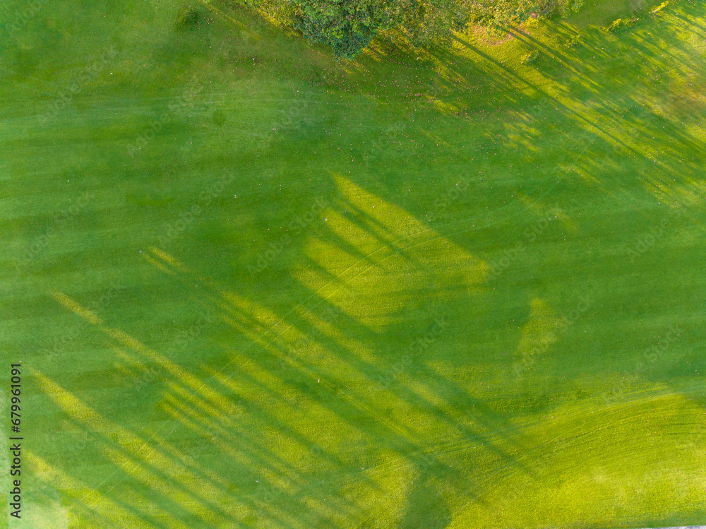 Aerial view of beautiful green golf field fairway and putting green, Top down image for sport background and travel nature background, Amazing green nature view Aerial view of beautiful green golf field fairway and putting green, Top down image for sport background and travel nature background, Amazing green nature view