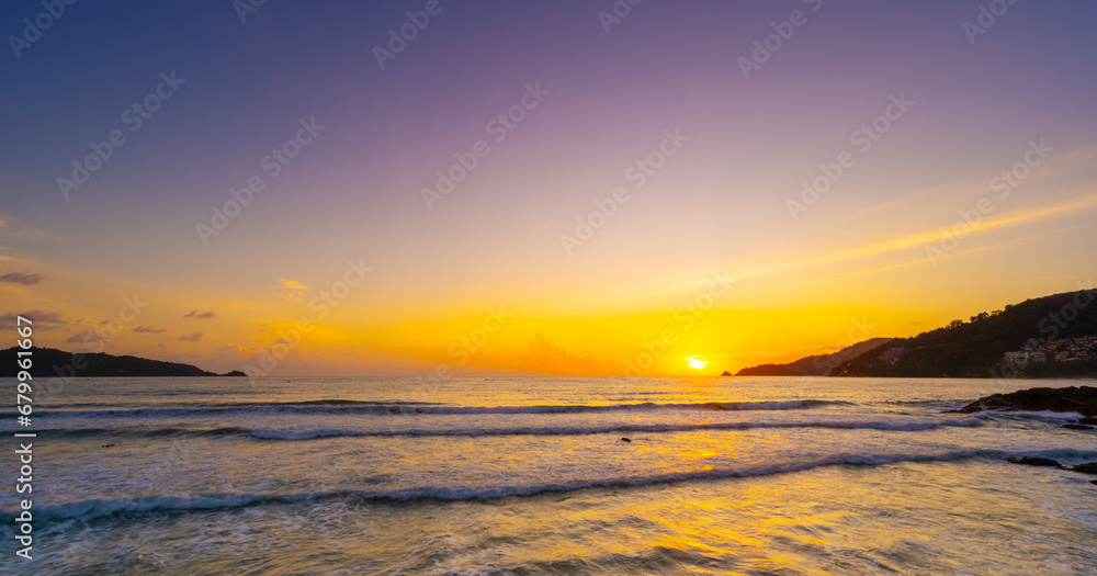 Amazing Sunset or sunrise sky clouds over sea sunlight with waves crashing on beach,Beautiful nature landscape seascape Colorful sky background