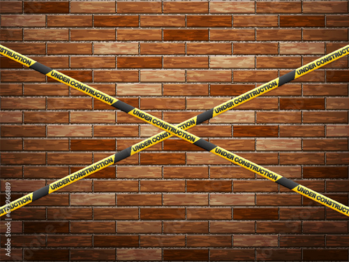 Under construction tape on bricks background