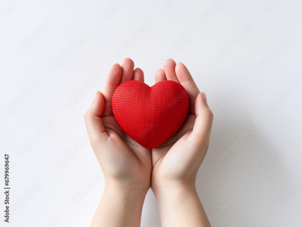 Young woman holding heart cushion. Symbol of love. Valentine’s day, anniversary day, mother’s day, father’s day Young woman holding heart cushion. Symbol of love. Valentine’s day, anniversary day, mother’s day, father’s day