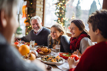 Family celebrating Christmas with champagne and sweets food at home. Winter holidays concept with people enjoying time and having fun eating together