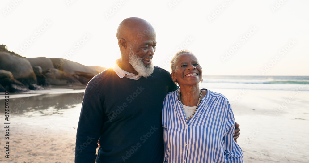 © Charlize D/peopleimages.com - Senior couple, smile and hug on beach, love and bonding on vacation, holiday and trip to ocean. Happy black people, embrace and support or trust, commitment and connection in marriage or retirement