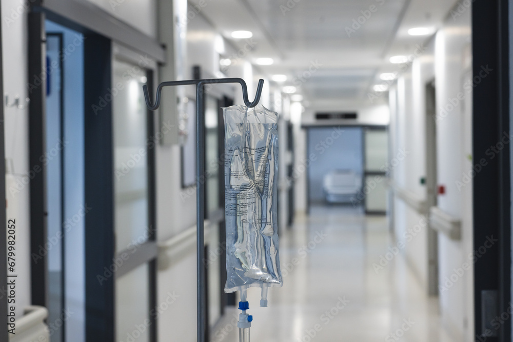 Close up of drip on hanger in hospital corridor Close up of drip on hanger in hospital corridor