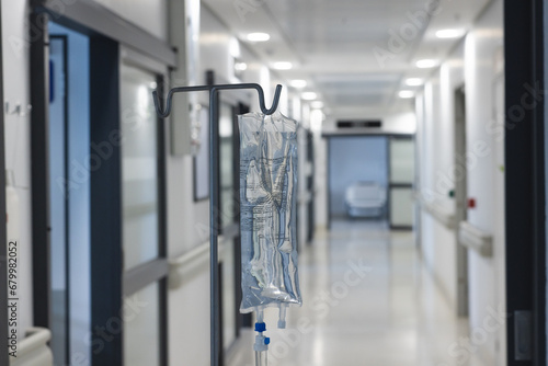 Fototapeta Naklejka Na Ścianę i Meble -  Close up of drip on hanger in hospital corridor