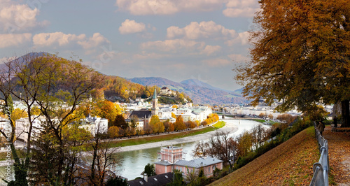 Photography Autumn season at a historic city of Salzburg with Salzach river in beautiful gol