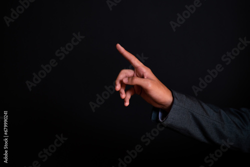 Male businessman in his hand and fingers Show symbol