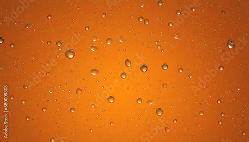 Orange background with droplets of water