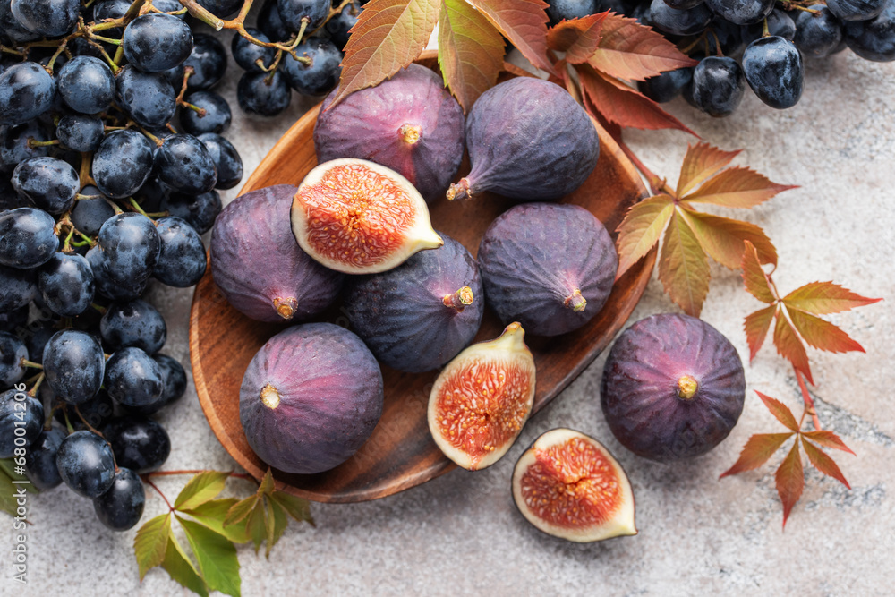 Fresh ripe figs and dark grapes Fresh ripe figs and dark grapes