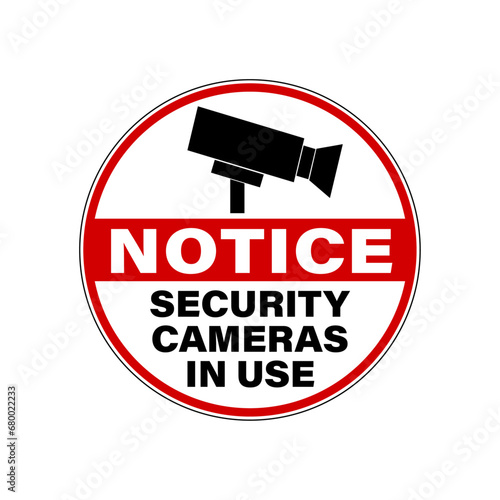 Notice, security cameras in use. Circle warning sign with symbol and text.